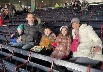 Leah Christoforidis with her family at Fenway park
